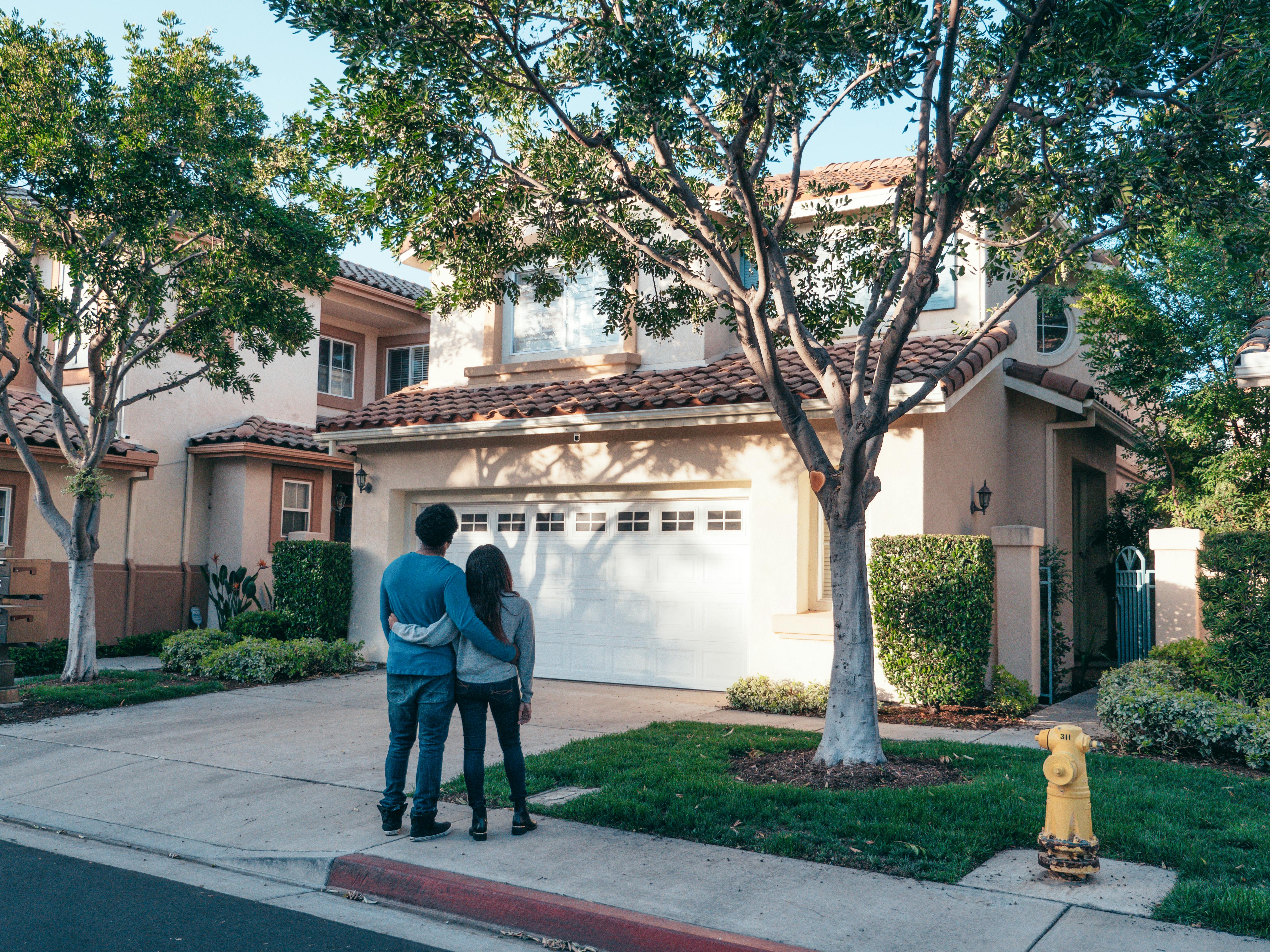 Happy homeowners with new garage door